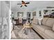 Cozy living room with comfortable seating, beach-themed decor, and abundant natural light at 6001-5124 S Kings Hwy., Myrtle Beach, SC 29575