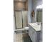 Bright bathroom with a shower, starfish decoration, and neutral tile flooring at 6001-O4 S Kings Hwy., Myrtle Beach, SC 29575