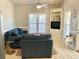 Inviting living room featuring built-in shelving, a plush sofa, and bright natural light at 6001-O4 S Kings Hwy., Myrtle Beach, SC 29575