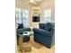 Charming living area with cozy chairs, a unique whale-shaped table, and coastal accents at 6001-O4 S Kings Hwy., Myrtle Beach, SC 29575