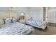 Bedroom showcases two twin beds with decorative pillows and fish-themed bedding, complemented by light blue walls at 6203 Catalina Dr. # 1822, North Myrtle Beach, SC 29582