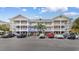 Condo building featuring spacious balconies and ample parking spaces for residents at 6203 Catalina Dr. # 1822, North Myrtle Beach, SC 29582