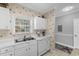 Bright kitchen with white cabinets, appliances, countertops, and a window view at 6203 Catalina Dr. # 1822, North Myrtle Beach, SC 29582
