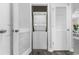 Efficient laundry closet with a stacked washer and dryer, offering convenience and space-saving design at 6203 Catalina Dr. # 1822, North Myrtle Beach, SC 29582