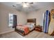 Cozy bedroom featuring neutral walls, a ceiling fan, and windows offering natural light at 624 Blackberry Ave., Murrells Inlet, SC 29576