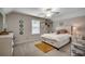 Bright bedroom with neutral walls, carpeted floors, ceiling fan, and ample natural light at 624 Blackberry Ave., Murrells Inlet, SC 29576