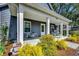 Inviting front porch adorned with planters, a bicycle, and rocking chairs for relaxing outdoors at 624 Blackberry Ave., Murrells Inlet, SC 29576