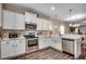 Charming kitchen with stainless steel appliances, white cabinets, and modern lighting fixtures at 624 Blackberry Ave., Murrells Inlet, SC 29576