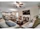 Inviting living room with comfortable seating, a ceiling fan, and abundant natural light at 624 Blackberry Ave., Murrells Inlet, SC 29576