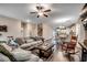Spacious living room featuring stylish decor, wood floors, and an open layout leading to the kitchen at 624 Blackberry Ave., Murrells Inlet, SC 29576