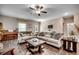 Inviting living room features a ceiling fan, plush sofas, wood accents, and stylish decor at 624 Blackberry Ave., Murrells Inlet, SC 29576