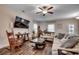 Cozy living room features a rocking chair, modern TV, wood accents, and natural light at 624 Blackberry Ave., Murrells Inlet, SC 29576