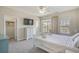 Bright bedroom features a large bed, ceiling fan, and a balcony for outdoor relaxation at 703 37Th Ave. S, North Myrtle Beach, SC 29582