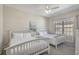 Bright bedroom features two beds, ceiling fan, and a large window at 703 37Th Ave. S, North Myrtle Beach, SC 29582