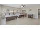 Bright bedroom features two beds, ceiling fan, and a small bar area at 703 37Th Ave. S, North Myrtle Beach, SC 29582