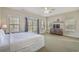 Bright bedroom featuring a king bed, neutral walls and carpet floor, along with large windows and double doors to balcony at 703 37Th Ave. S, North Myrtle Beach, SC 29582