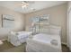 Bright bedroom features two beds, neutral walls and carpet floor, along with a window with blinds at 703 37Th Ave. S, North Myrtle Beach, SC 29582