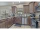 Spacious kitchen features stainless steel appliances, granite counters, and ample cabinet space at 703 37Th Ave. S, North Myrtle Beach, SC 29582