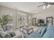 Relaxing living room featuring French doors to the outdoor patio, a TV, and comfortable sofas for lounging at 703 37Th Ave. S, North Myrtle Beach, SC 29582