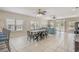 Bright and airy living room with large windows, a dining table, and comfortable seating for Gathering and friends at 703 37Th Ave. S, North Myrtle Beach, SC 29582