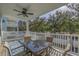 Covered outdoor patio with a dining table and seating, perfect for enjoying meals and relaxing in the fresh air at 703 37Th Ave. S, North Myrtle Beach, SC 29582