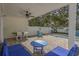 Backyard pool area with plenty of seating, dining table and ceiling fan at 703 37Th Ave. S, North Myrtle Beach, SC 29582