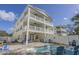 Beautiful multi-story beach house featuring a private pool and multiple balconies for enjoying outdoor living at 703 37Th Ave. S, North Myrtle Beach, SC 29582