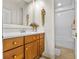 Bathroom featuring vanity, drawers, tile flooring, and decorative accents at 7584 Regina Ct., Myrtle Beach, SC 29572