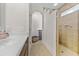 Bathroom showcasing a vanity and walk-in shower with a tiled surround at 7584 Regina Ct., Myrtle Beach, SC 29572