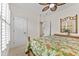 Bedroom showcasing a wicker bed frame and shutters offering natural light at 7584 Regina Ct., Myrtle Beach, SC 29572