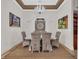 Elegant dining room featuring a stylish chandelier, comfortable seating, and tasteful decor at 7584 Regina Ct., Myrtle Beach, SC 29572