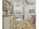 Grand foyer with a decorative rug, elegant furnishings, and stunning views of the home's architecture at 7584 Regina Ct., Myrtle Beach, SC 29572