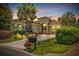 Stunning home exterior featuring a landscaped yard, inviting entrance, and lovely curb appeal at twilight at 7584 Regina Ct., Myrtle Beach, SC 29572