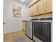 Well-equipped laundry room with modern appliances and ample cabinet space at 7584 Regina Ct., Myrtle Beach, SC 29572