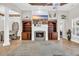 Cozy living room featuring a fireplace, TV, and built-in shelving at 7584 Regina Ct., Myrtle Beach, SC 29572