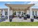 Covered patio with comfortable seating, ideal for outdoor dining and relaxation at 7584 Regina Ct., Myrtle Beach, SC 29572