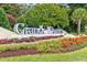 Beautiful 'Grande Dunes' welcome sign framed by colorful landscaping, signaling entry into a premier community at 7584 Regina Ct., Myrtle Beach, SC 29572