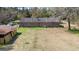 A high-angle aerial view showcases the back of the home and outbuildings at 77 Towhee St., Georgetown, SC 29440