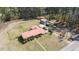 An aerial view of a property with a brick home, large yard, and mature trees at 77 Towhee St., Georgetown, SC 29440