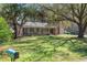 Charming brick home with a welcoming front porch and a lush, green lawn at 77 Towhee St., Georgetown, SC 29440