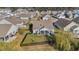 Aerial view of a well-kept home with a fenced backyard, screened-in porch, and lush landscaping at 804 Yauhannah Dr., Little River, SC 29566