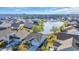 Overhead view of homes surrounding a picturesque lake, showcasing the community's serene setting and lush landscaping at 804 Yauhannah Dr., Little River, SC 29566