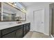 Modern bathroom featuring a double vanity, large mirror, and stylish fixtures at 804 Yauhannah Dr., Little River, SC 29566