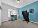 Carpeted bedroom with a treadmill and a blue accent wall at 804 Yauhannah Dr., Little River, SC 29566