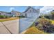 Well-maintained home with a two-car garage and a long driveway surrounded by lush landscaping at 804 Yauhannah Dr., Little River, SC 29566