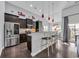Modern kitchen with dark cabinets, stainless steel appliances, and a breakfast bar at 804 Yauhannah Dr., Little River, SC 29566