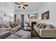 Inviting living room featuring a fireplace, large windows, and stylish decor at 804 Yauhannah Dr., Little River, SC 29566