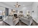 Spacious living room with a fireplace, ceiling fan, and comfortable seating area at 804 Yauhannah Dr., Little River, SC 29566