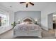 Main bedroom featuring a large bed, a plant, and ceiling fan at 804 Yauhannah Dr., Little River, SC 29566