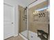 Elegant bathroom shower with glass enclosure, tiled walls, and built-in shelving at 804 Yauhannah Dr., Little River, SC 29566
